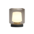 Trådlös bordslampa från sackit med varmvit belysning i transparent kåpa och svart rund bas för inom och utomhusbruk