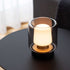 Trådlös bordslampa Ambience Intelligent från sackit med svart glas och varmt sken på ett mörkt bord