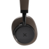 Närbild av bruna Touch 400 over ear hörlurar från sackit med vadderad öronkåpa och diskret X symbol mot svart bakgrund