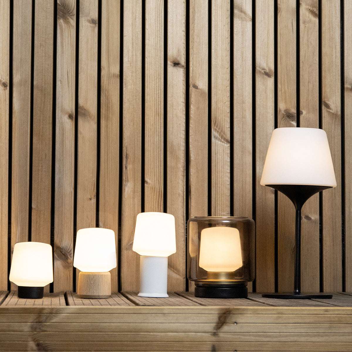 Ambience Lamp Intelligent with a smooth white lampshade and compact round base for indoor or outdoor use