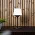 Lamp base with frosted opal glass and stainless steel for indoor and outdoor use.